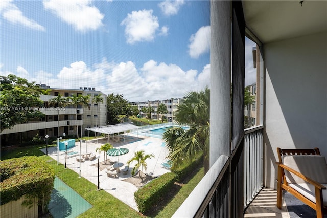 1680 NE 191st St Unit 307-2, Miami, FL 33179 - balcony with view of pool and a patio area