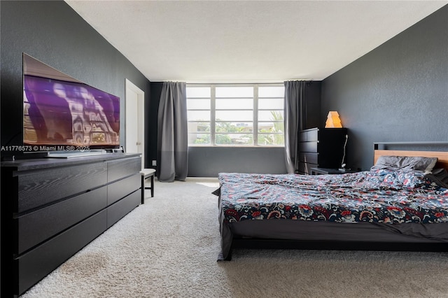 1680 NE 191st St Unit 307-2, Miami, FL 33179 - bedroom with carpet flooring and a textured wall