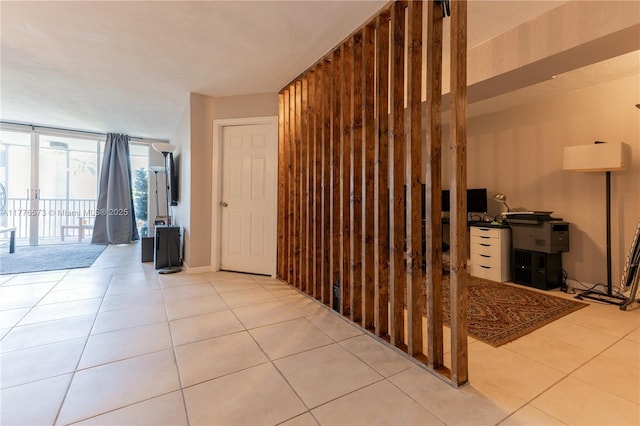 1680 NE 191st St Unit 307-2, Miami, FL 33179 - hall with tile patterned floors and expansive windows