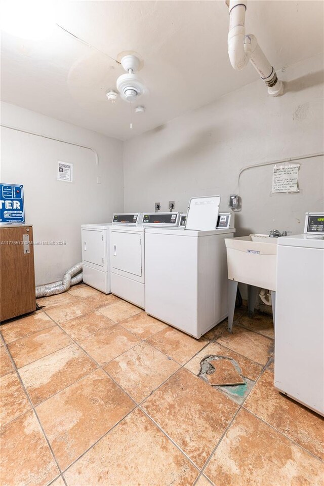1680 NE 191st St Unit 307-2, Miami, FL 33179 - community laundry room featuring washer and dryer