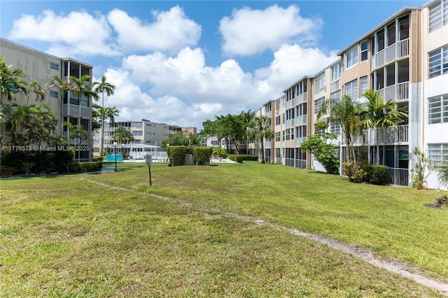 1680 NE 191st St Unit 307-2, Miami, FL 33179 - view of property's community with a lawn
