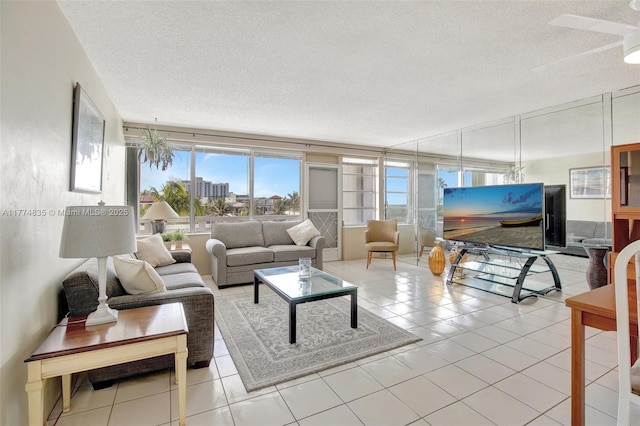 3111 N Ocean Dr Unit 308, Hollywood, FL 33019 - living area featuring tile patterned floors and a textured ceiling
