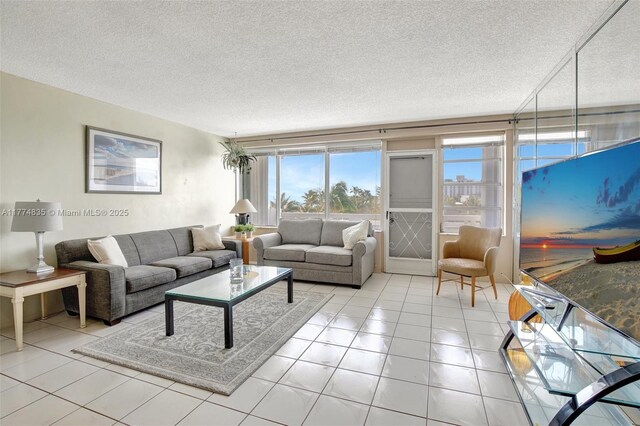 3111 N Ocean Dr Unit 308, Hollywood, FL 33019 - living room featuring a textured ceiling and light tile patterned floors