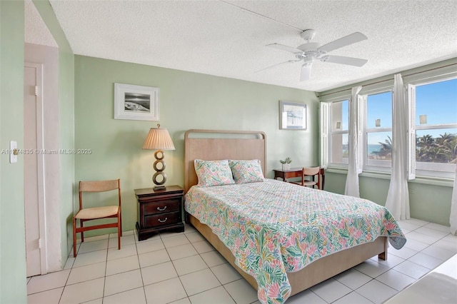 3111 N Ocean Dr Unit 308, Hollywood, FL 33019 - bedroom with a textured ceiling, a ceiling fan, and light tile patterned floors