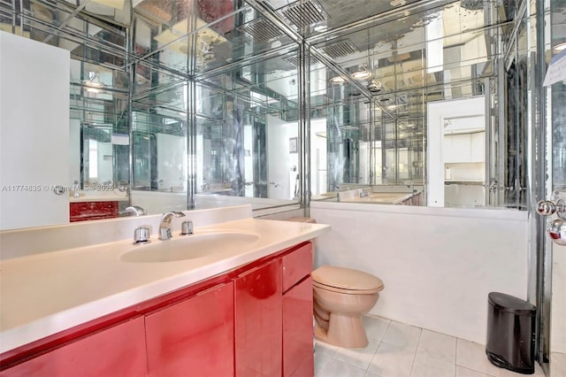 3111 N Ocean Dr Unit 308, Hollywood, FL 33019 - bathroom featuring tile patterned floors, toilet, and vanity