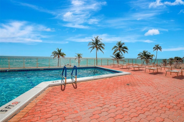3111 N Ocean Dr Unit 308, Hollywood, FL 33019 - view of swimming pool featuring fence and a patio