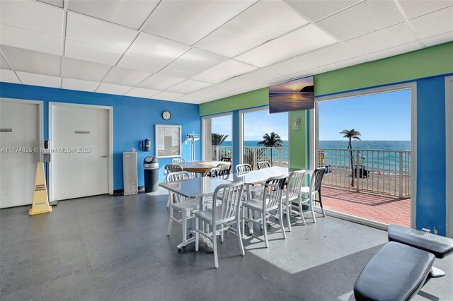 3111 N Ocean Dr Unit 308, Hollywood, FL 33019 - dining area featuring a water view and a drop ceiling