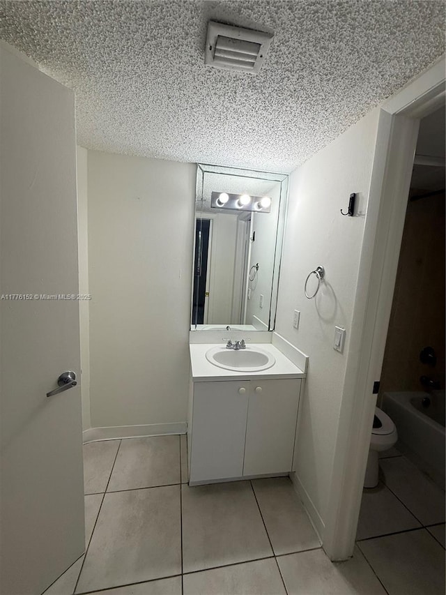 8335 SW 152nd Ave Unit B-106, Miami, FL 33193 - full bath with a textured ceiling, tile patterned floors, and vanity