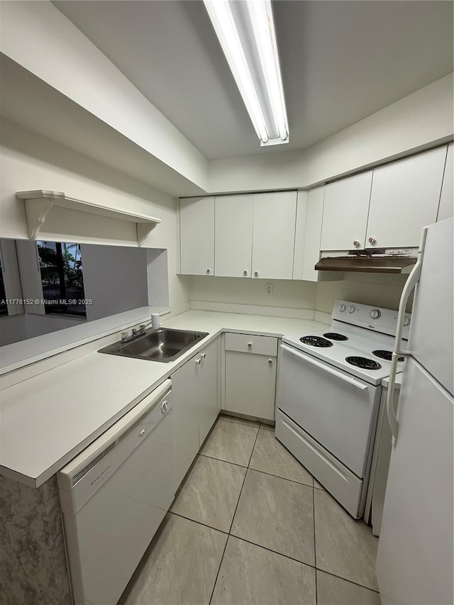 8335 SW 152nd Ave Unit B-106, Miami, FL 33193 - kitchen with white appliances, under cabinet range hood, light tile patterned floors, and white cabinets