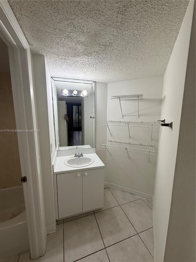 8335 SW 152nd Ave Unit B-106, Miami, FL 33193 - full bathroom with vanity, tile patterned flooring, and a textured ceiling