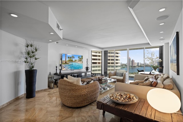 living room with marble finish floor, visible vents, recessed lighting, and a raised ceiling