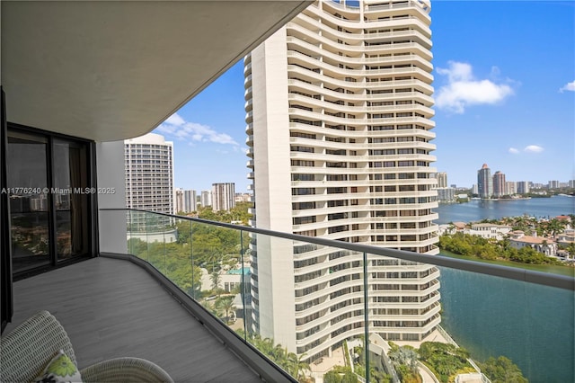 balcony featuring a water view and a view of city