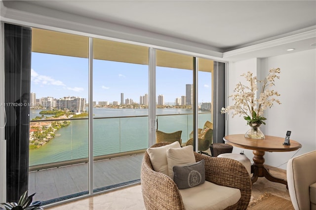 sunroom / solarium featuring a healthy amount of sunlight, a water view, and a view of city