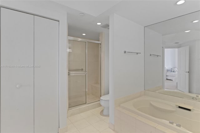 full bath featuring a stall shower, toilet, tile patterned flooring, and recessed lighting