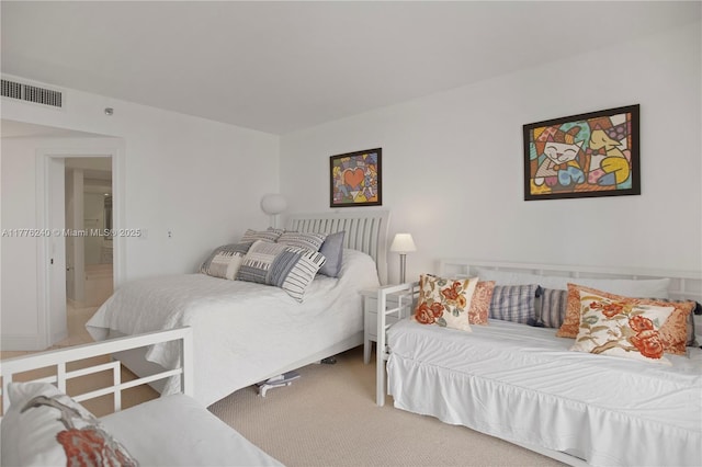 carpeted bedroom with visible vents
