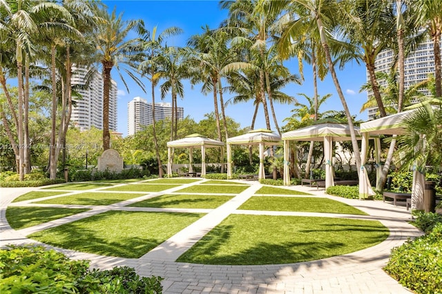 surrounding community featuring a gazebo and a lawn