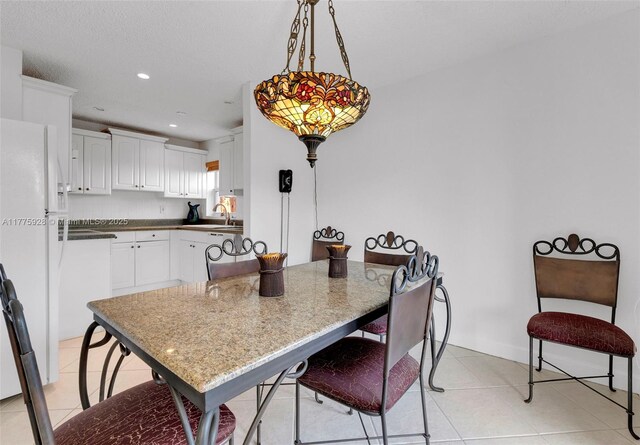 dining room with recessed lighting and light tile patterned flooring