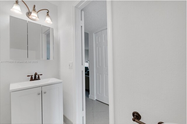 bathroom featuring tile patterned floors and vanity