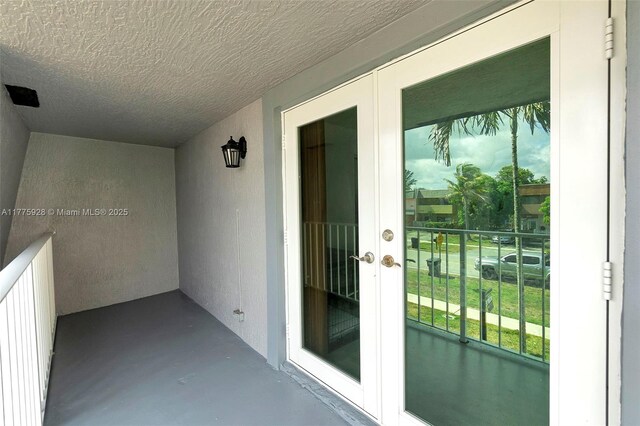 balcony featuring french doors