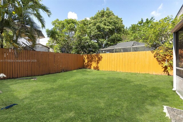 view of yard with a fenced backyard