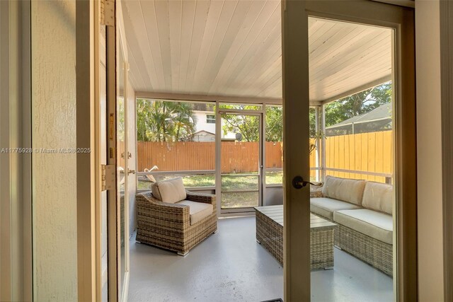 sunroom / solarium with outdoor lounge area and french doors