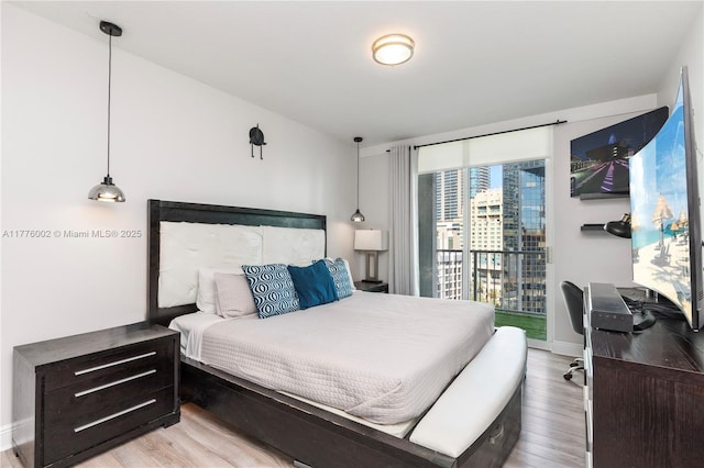 1250 S Miami Ave Unit 1206, Miami, FL 33130 - bedroom with wood finished floors and access to outside