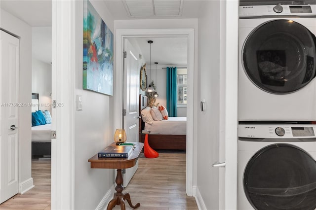 1250 S Miami Ave Unit 1206, Miami, FL 33130 - laundry room with stacked washing machine and dryer and wood finished floors