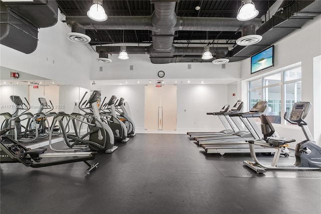 1250 S Miami Ave Unit 1206, Miami, FL 33130 - exercise room featuring a high ceiling and baseboards