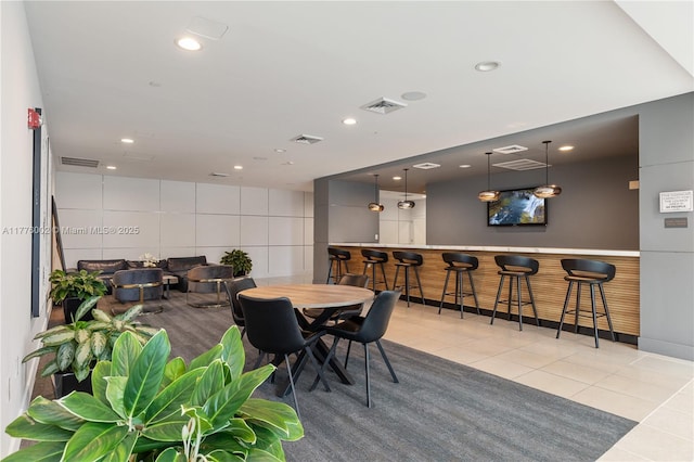 1250 S Miami Ave Unit 1206, Miami, FL 33130 - dining space with tile patterned floors, a bar, and recessed lighting