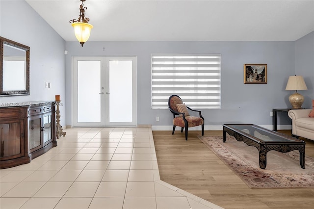 11472 SW 28th Ter, Miami, FL 33165 - living area with healthy amount of natural light, french doors, light wood-style flooring, and baseboards