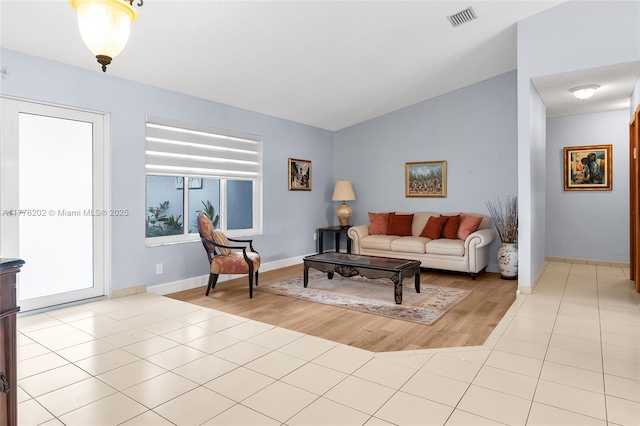 11472 SW 28th Ter, Miami, FL 33165 - living room with vaulted ceiling, light tile patterned floors, and baseboards