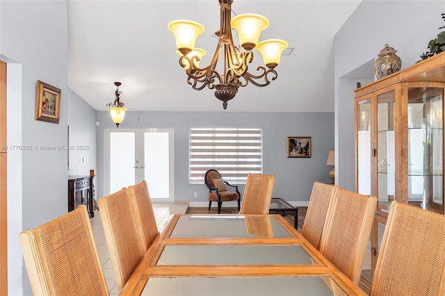 11472 SW 28th Ter, Miami, FL 33165 - dining room featuring french doors, a chandelier, and baseboards