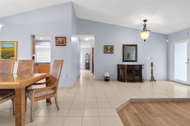 11472 SW 28th Ter, Miami, FL 33165 - dining room with vaulted ceiling, light tile patterned floors, and baseboards