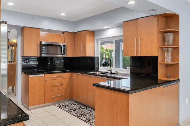 11472 SW 28th Ter, Miami, FL 33165 - kitchen featuring stainless steel microwave, a sink, dark stone countertops, decorative backsplash, and recessed lighting