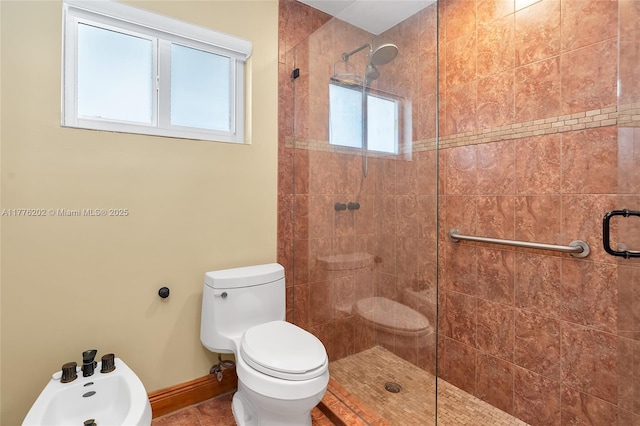 11472 SW 28th Ter, Miami, FL 33165 - bathroom with tiled shower, baseboards, toilet, and tile patterned floors
