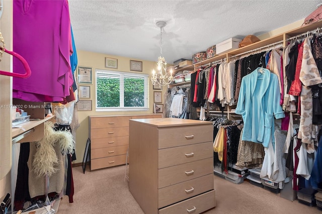 11472 SW 28th Ter, Miami, FL 33165 - walk in closet featuring a chandelier and light colored carpet