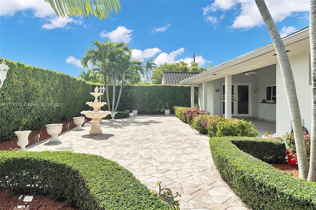 11472 SW 28th Ter, Miami, FL 33165 - view of patio with a ceiling fan and fence