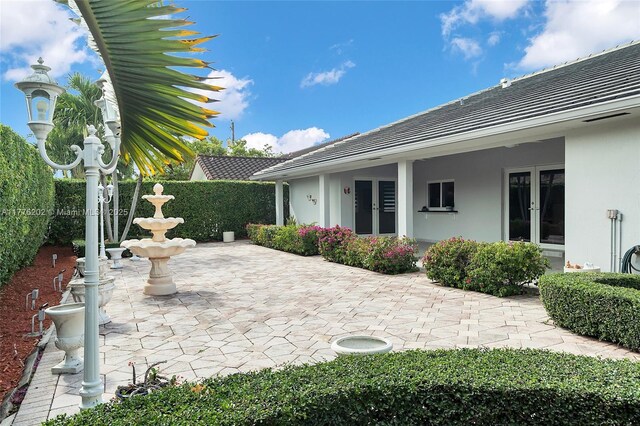 11472 SW 28th Ter, Miami, FL 33165 - view of patio / terrace with french doors and fence