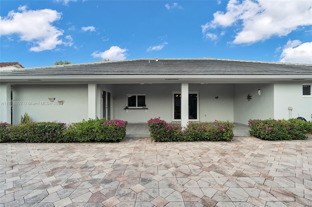 11472 SW 28th Ter, Miami, FL 33165 - doorway to property featuring stucco siding and a tiled roof