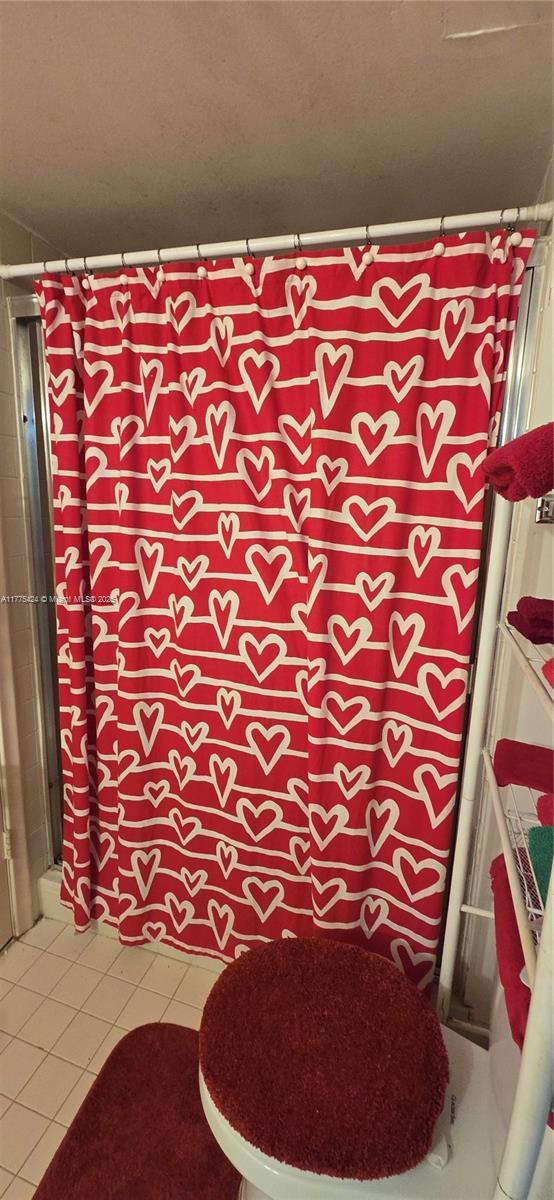bathroom with tile patterned floors