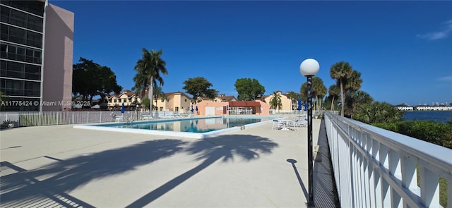 community pool with a patio