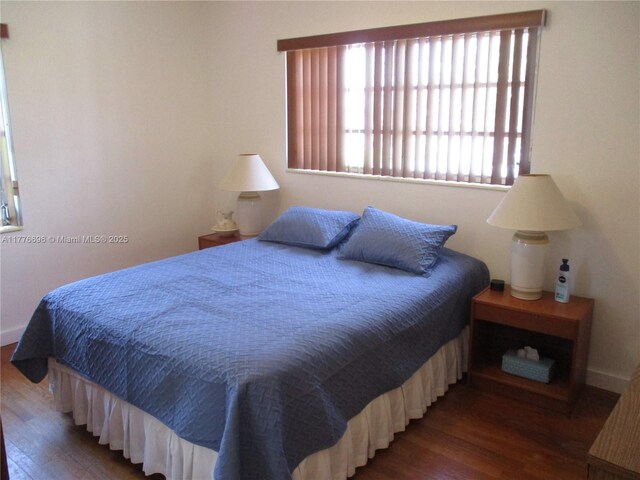 105 NW 32nd Pl, Miami, FL 33125 - bedroom featuring wood finished floors and baseboards