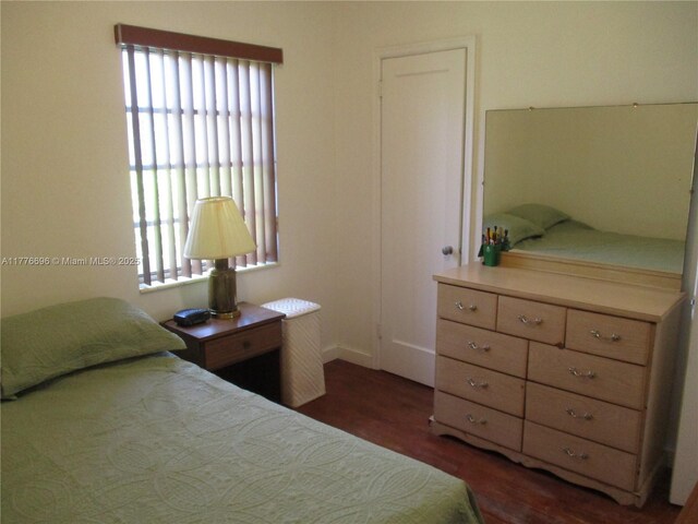 105 NW 32nd Pl, Miami, FL 33125 - bedroom with wood finished floors and multiple windows