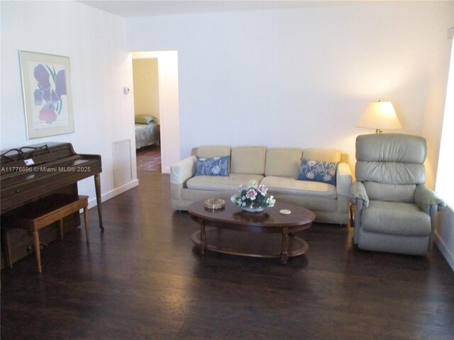 105 NW 32nd Pl, Miami, FL 33125 - living area featuring wood finished floors and baseboards