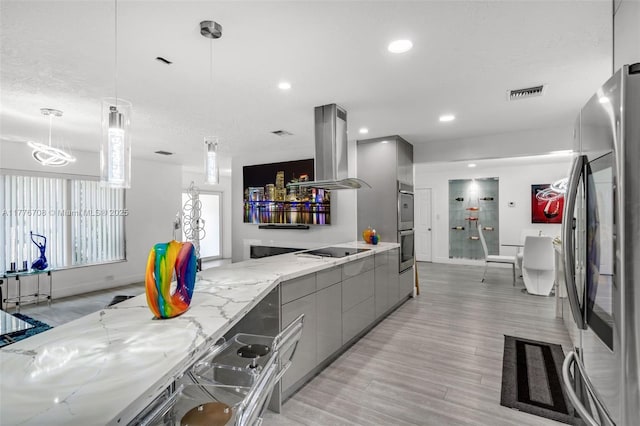 kitchen with stainless steel appliances, island exhaust hood, gray cabinetry, visible vents, and modern cabinets