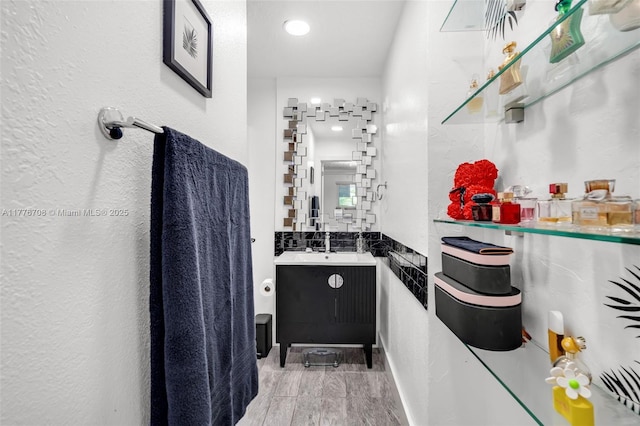 bathroom featuring vanity and wood tiled floor