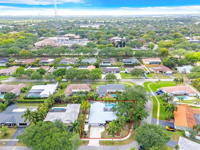 birds eye view of property with a residential view