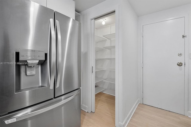 700 Biltmore Way Unit 402, Coral Gables, FL 33134 - kitchen with stainless steel fridge, light wood finished floors, and baseboards