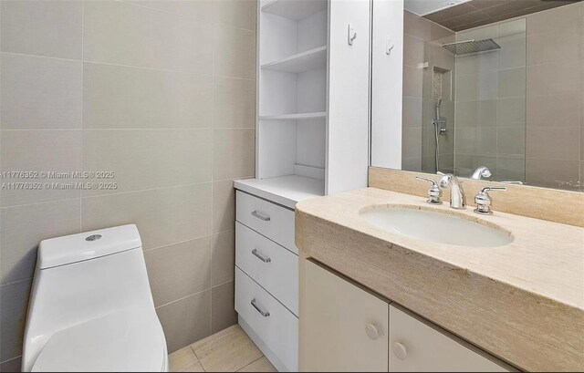 700 Biltmore Way Unit 402, Coral Gables, FL 33134 - bathroom with vanity, tiled shower, toilet, and tile walls