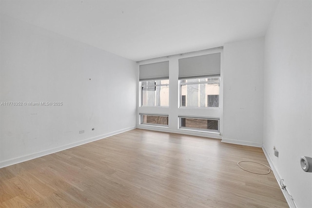 700 Biltmore Way Unit 402, Coral Gables, FL 33134 - spare room with light wood-style floors and baseboards